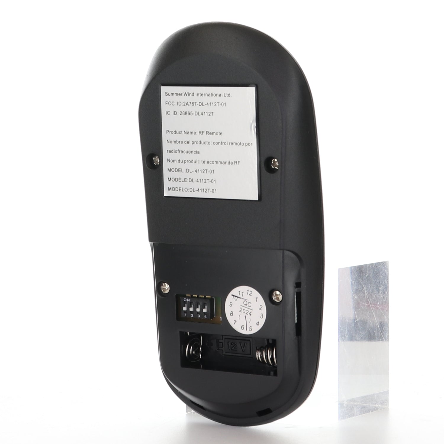 A Home Decorators Collection Merwry Ceiling Fan Replacement Remote Control (13431102701301, DL-4112T-01, 2A767-DL-4112T-01) in black is shown with the battery cover removed, revealing a label, dip switches, rotary dial, and battery compartment.