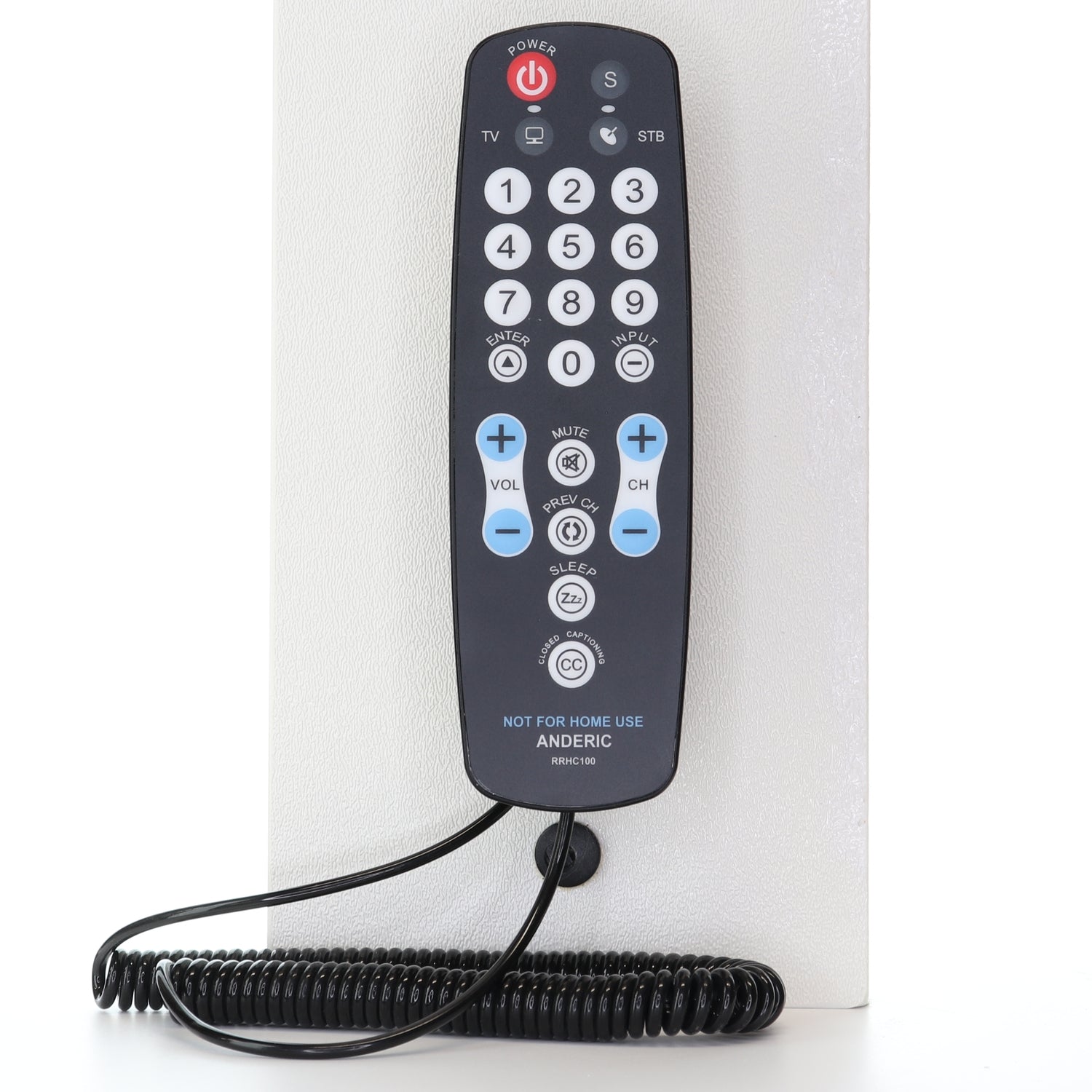 The Anderic Universal Tether Coiled Security Cable (CBL01) is shown securing a black Anderic remote with large white buttons labeled for TV and STB, set against a white background.
