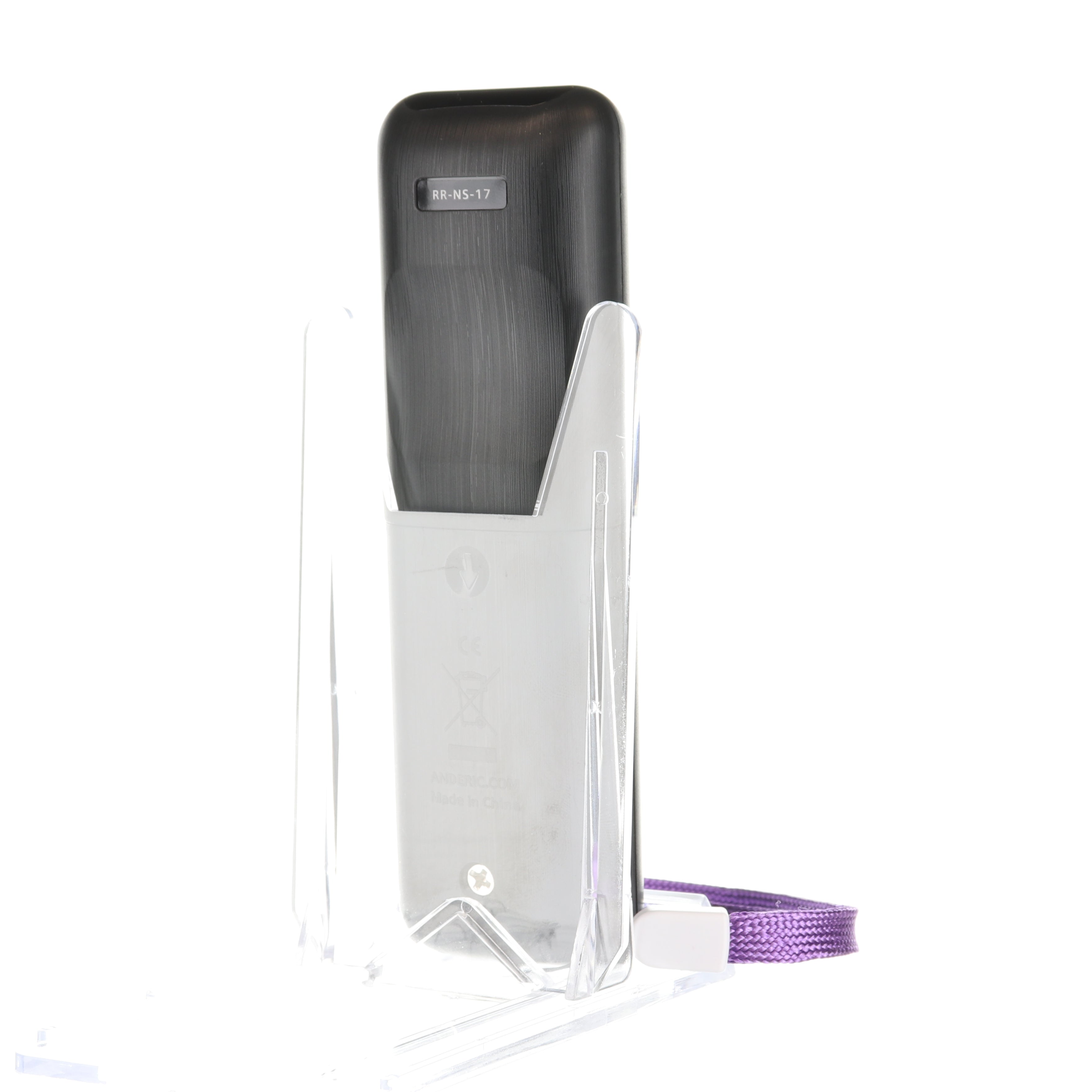 The Anderic RRNS17 for Insignia Roku Enhanced TV remote control, featuring a black and gray design with a purple strap, stands upright in a clear plastic stand.