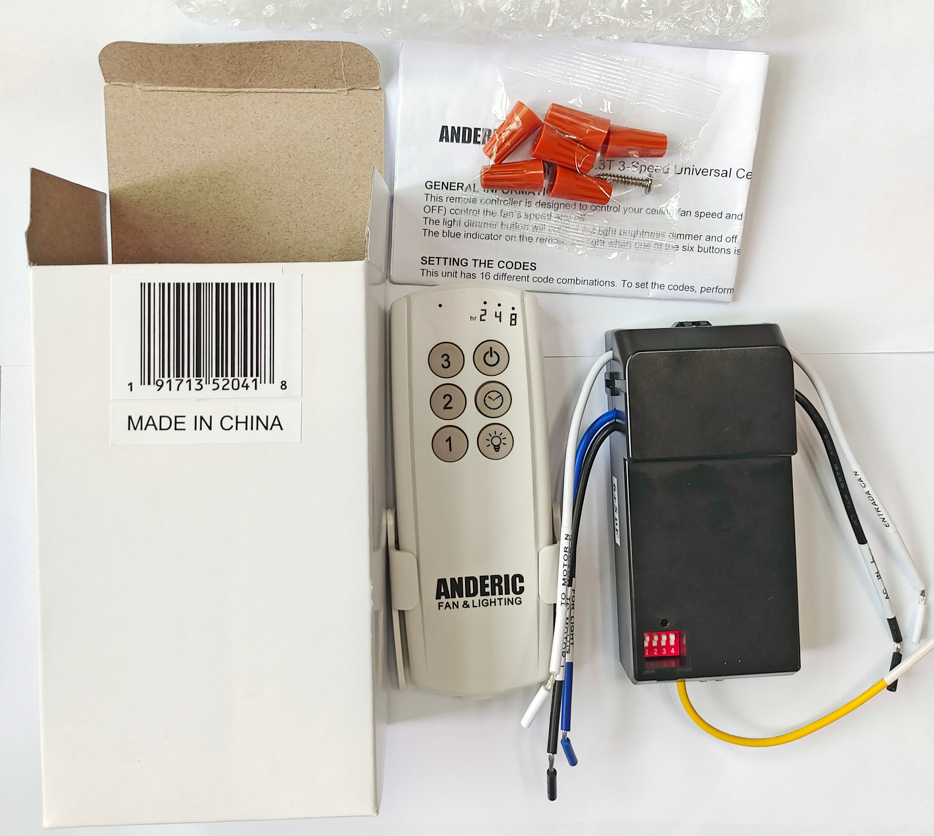 The Anderic 63T-AC83T-KIT is a universal 3-speed ceiling fan remote control kit with LED compatibility. It includes wiring components, orange wire connectors, and an instruction manual. Box states "Made in China." Enjoy convenient fan speed control with timer functionality.