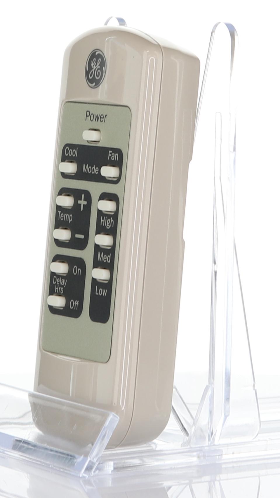 The GE General Electric WJ26X21700 Air Conditioner Remote Control features buttons for power, mode, fan, temperature, high/low settings, and a timer. It is beige and shown on a clear plastic stand.