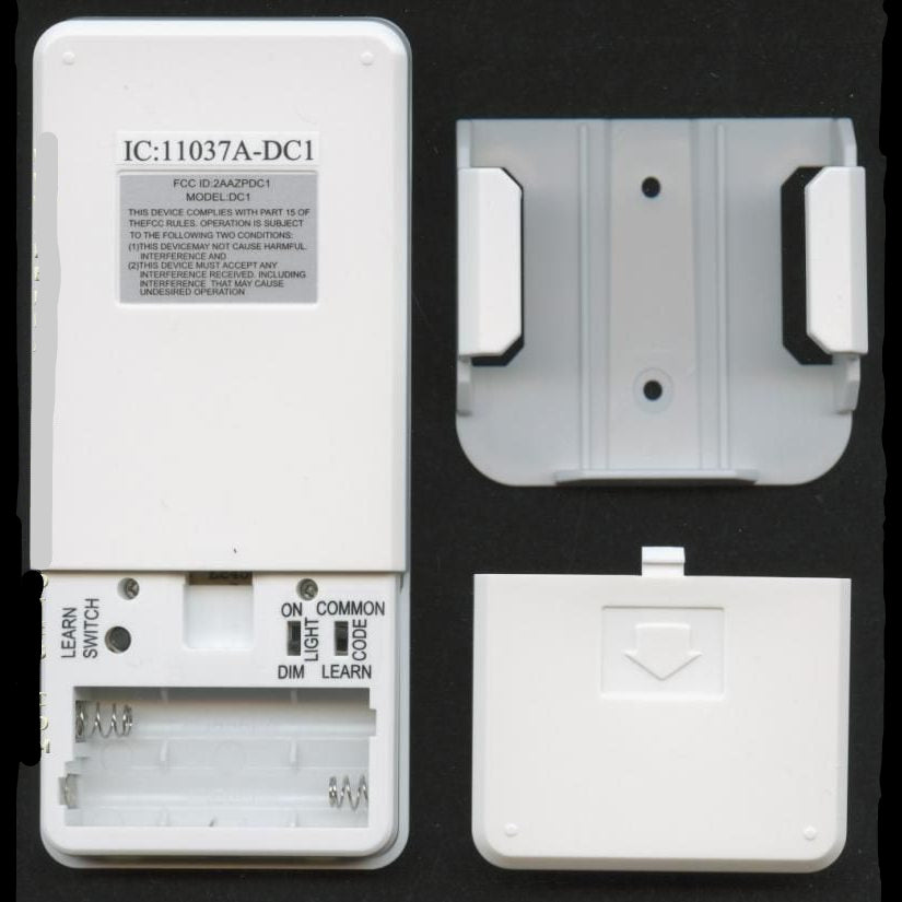 The white Anderic DC1 remote, designed for Hampton Bay/Monte Carlo ceiling fans, features an open battery compartment, gray mounting bracket, learn switch, light/dim buttons, and code indicator. It's ideal for operating your ceiling fan remote or DC receiver motor system seamlessly.