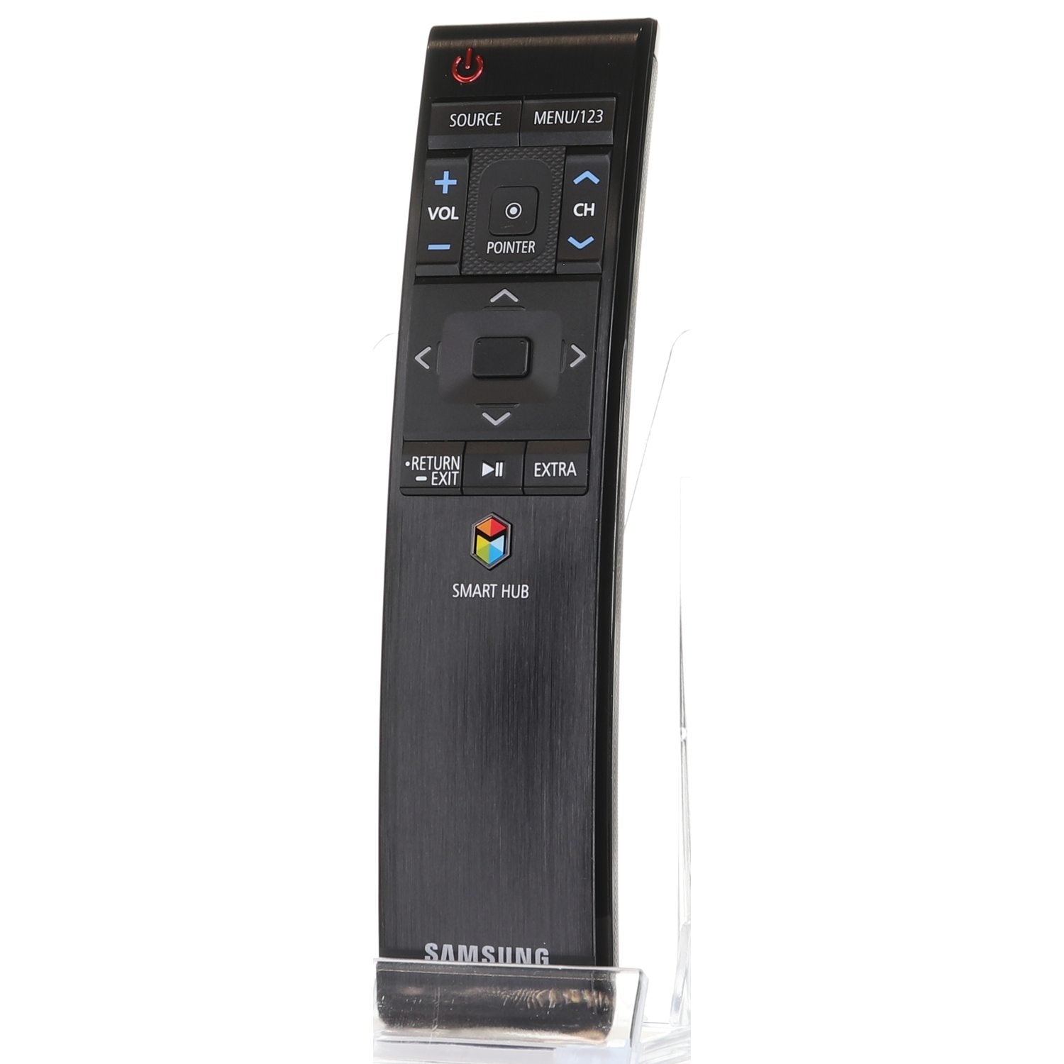 The Samsung BN59-01220E 2015 SMART RF TV Remote Control is shown upright on a clear stand, featuring a black casing and buttons for volume, channel, menu, source, and Smart Hub functions.