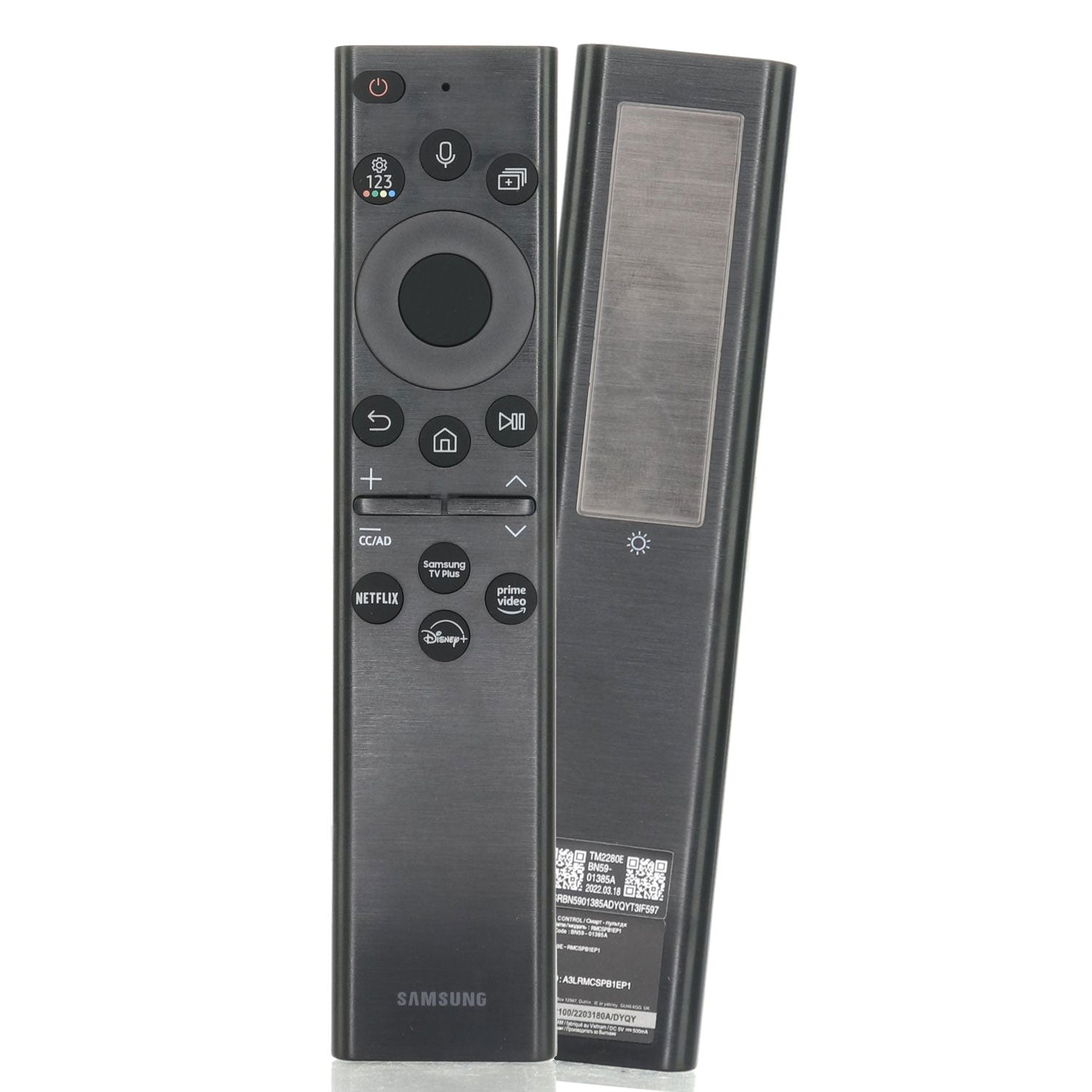 Two Samsung BN5901385A / TM2280E Smart SolarCell Remotes, one facing forward with control buttons and the other showing the solar panel for charging. Complements your QLED TV experience with Samsung TV Plus, Netflix, Prime, and Disney+.