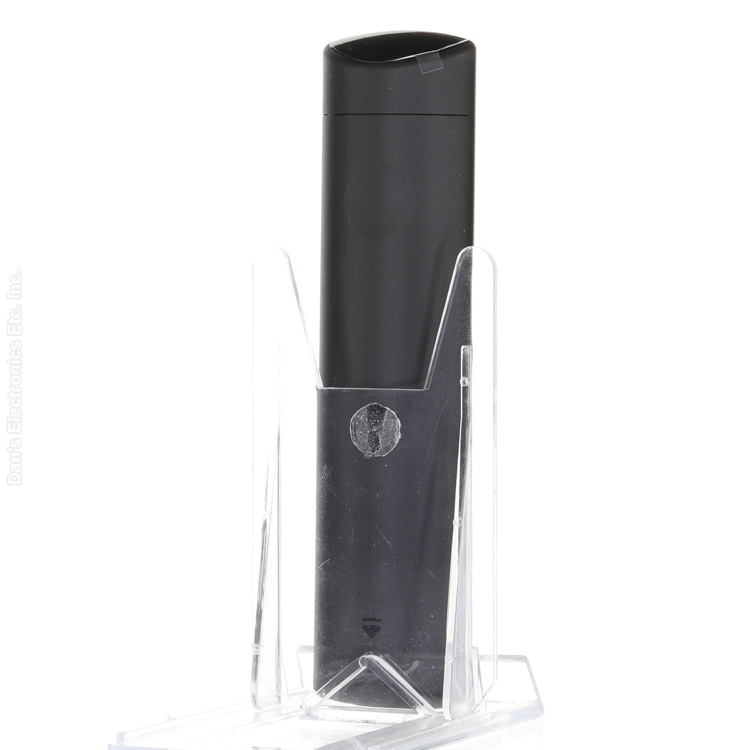 The black rectangular vape pen, styled like a TOSHIBA CT95018 FIRE Late 2023 TV Remote Control, is displayed upright on a transparent stand.