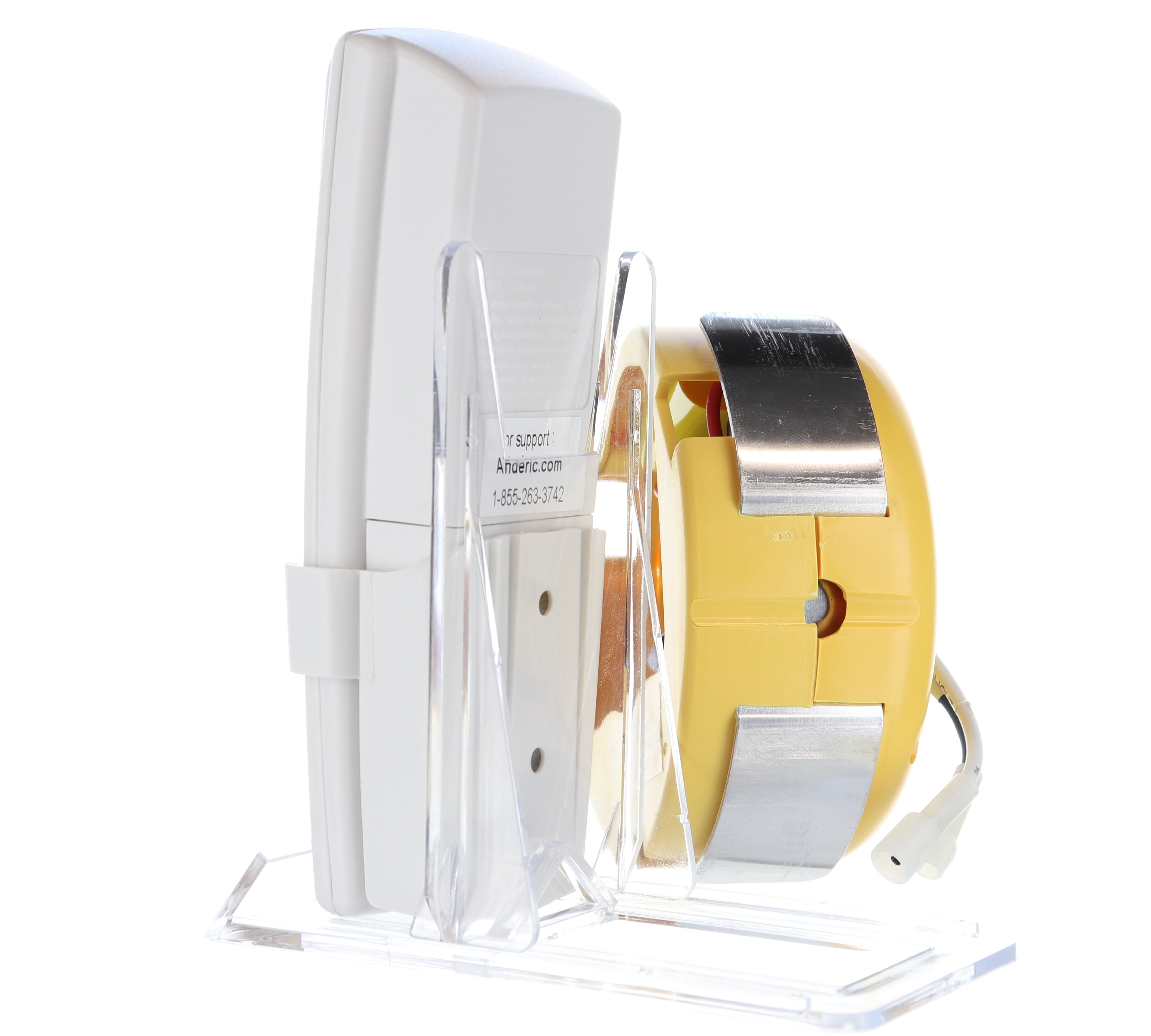 The Anderic FAN2R/RR7078TR for Hampton Bay/HUNTER is a white and yellow electronic device with a silver band on a transparent stand, used as the ceiling fan control system.