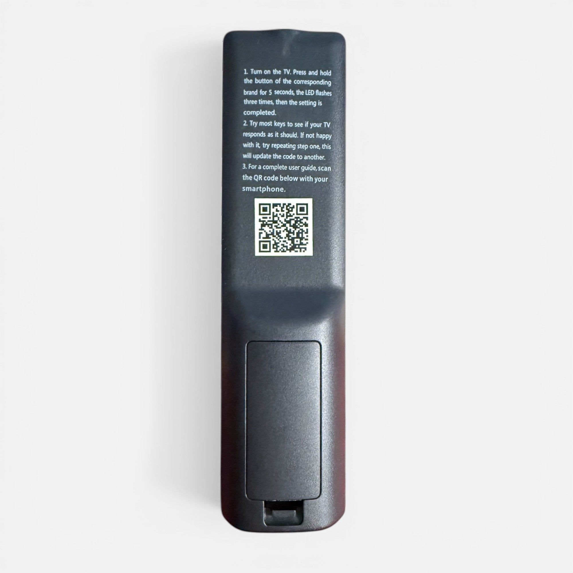 Anderic replacement TV remote control back view featuring programming instructions and a QR code on a black surface