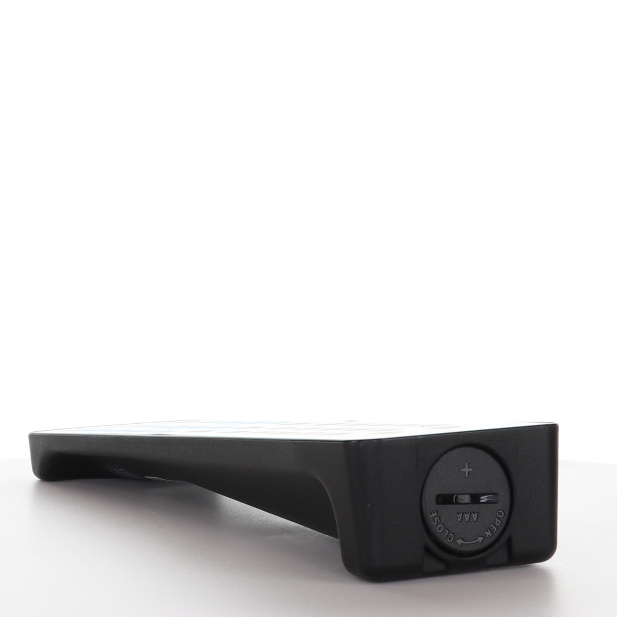 Anderic RR1003 antimicrobial universal remote control showing the battery compartment on the bottom base